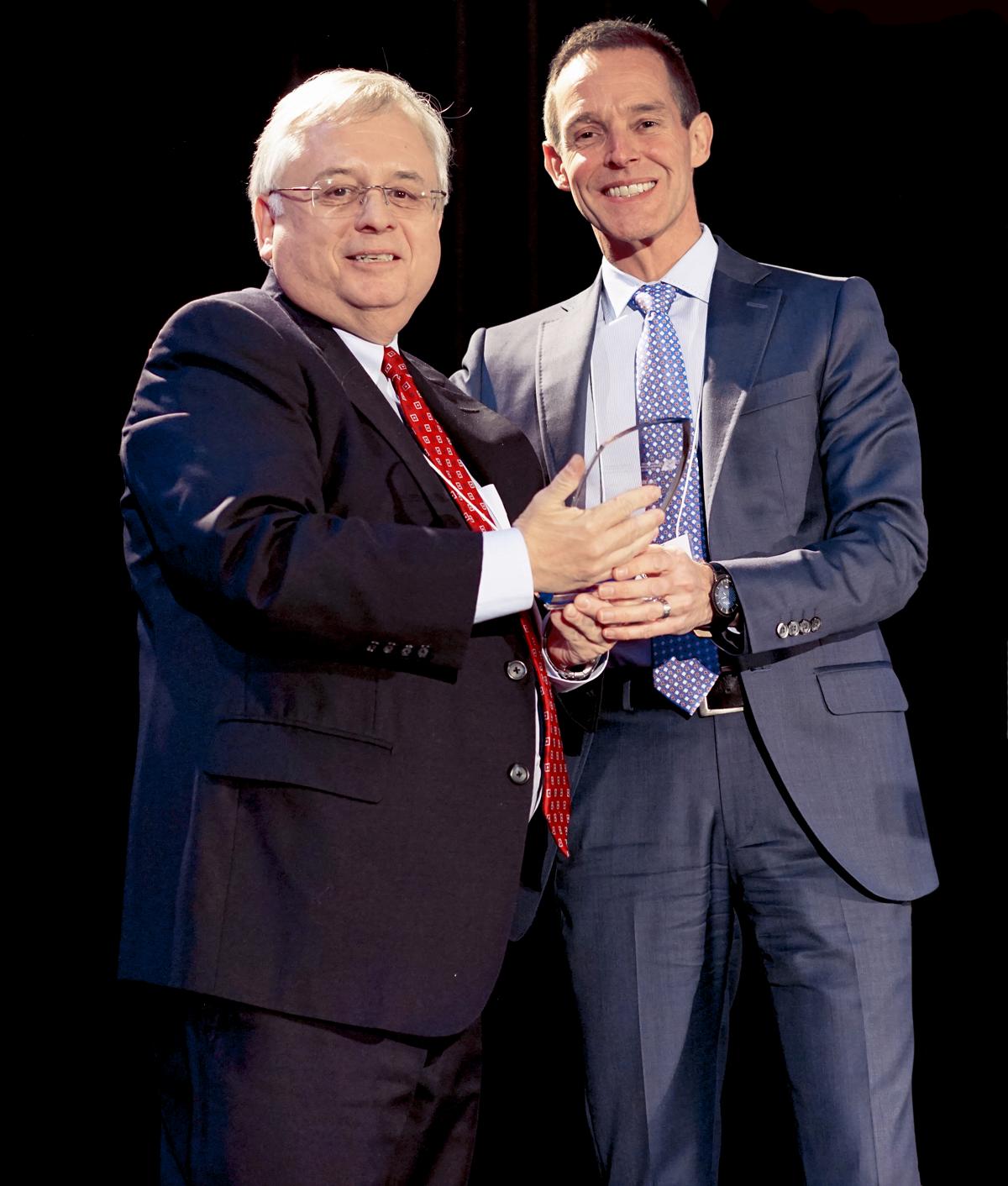 Richard Dixon, Vice President and Human Resources Officer of NAV CANADA, is presented the C.M. Hincks award by Peter Coleridge, CEO of the Canadian Mental Health Association at the 12th annual Bottom Line Conference, Tuesday, Feb. 24 at the Vancouver Convention Centre.