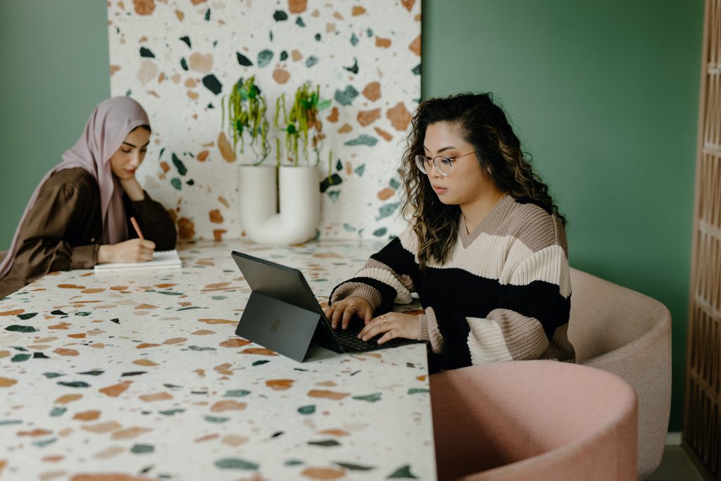 Female entrepreneurs working on computers